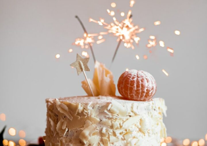 cake with lit sparkling stick